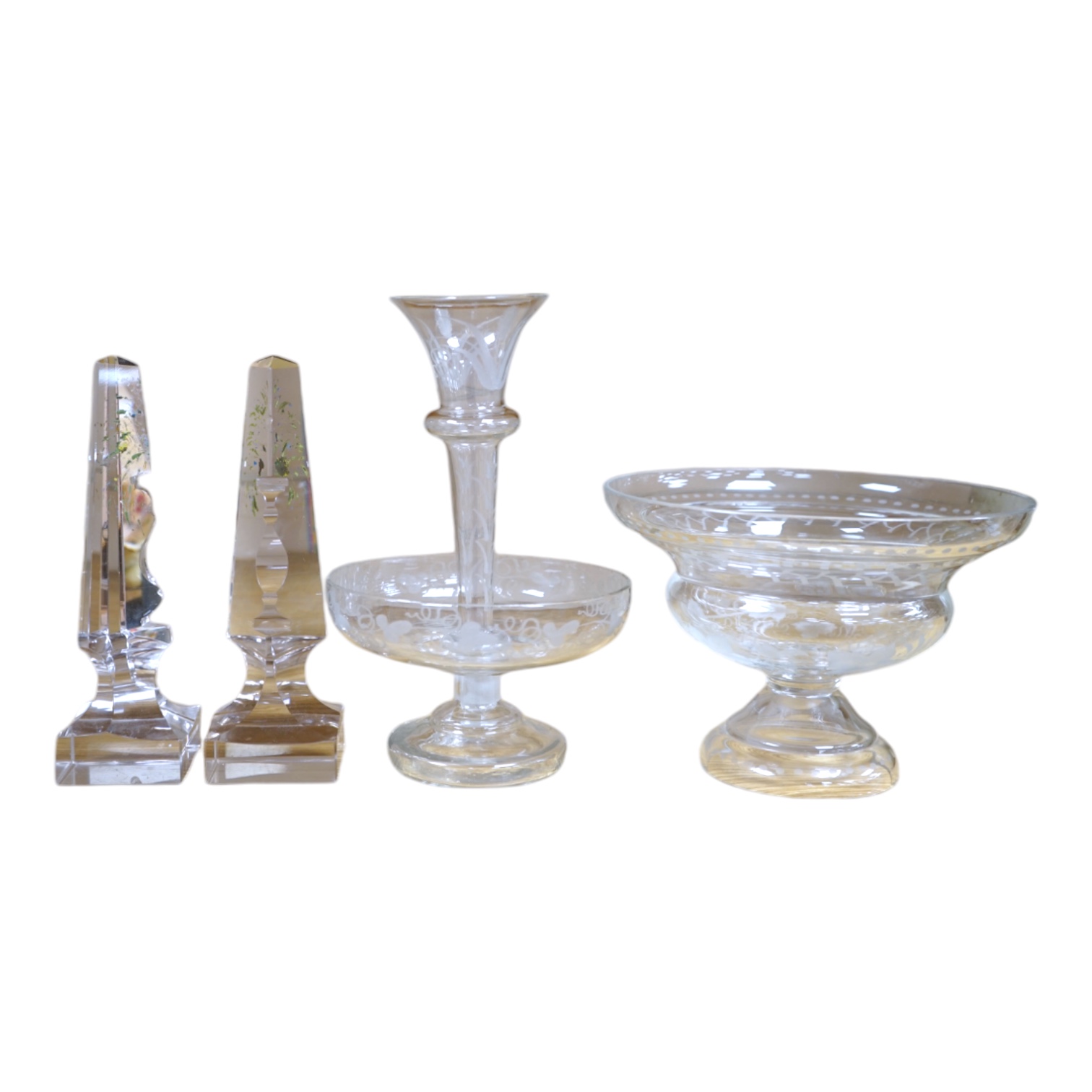 Victorian and later glassware comprising a pair of glass obelisks, an epergne and a similar glass pedestal dish, epergne 24cm high. Condition - obelisk painting worn, all good condition